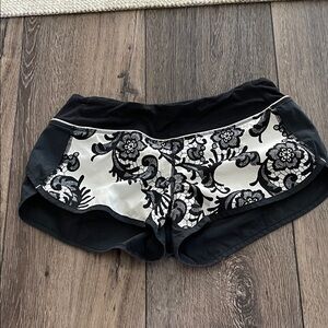 Lululemon shorts, size 6, black with light gray background and built in panties